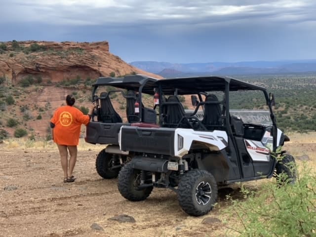 - Vortex ATV Rental 2-seater and 4-seater atv rental customer posing outside ATV in the beautiful Verde Valley